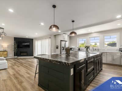 Open-concept kitchen and living area with modern design elements.